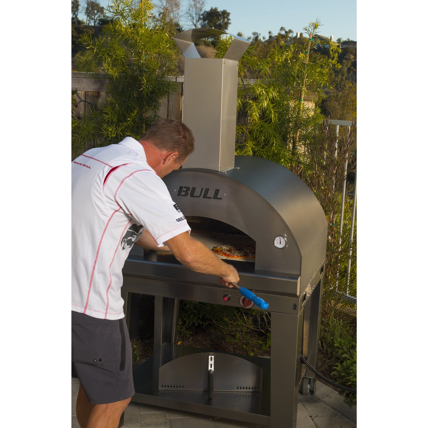 PIZZA_OVEN.LP-person placing pizza