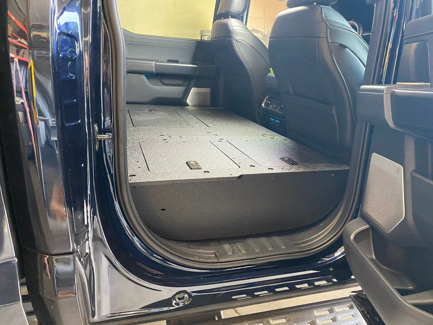 GOOSE GEAR Ford Super Duty Ford - F250-F350 - 2023-Present - 5th Gen. Crew Cab - Second Row Seat Delete Plate System with Factory B&O Subwoofer Center Wall with Exterior Port - 1210-GGR-SH
